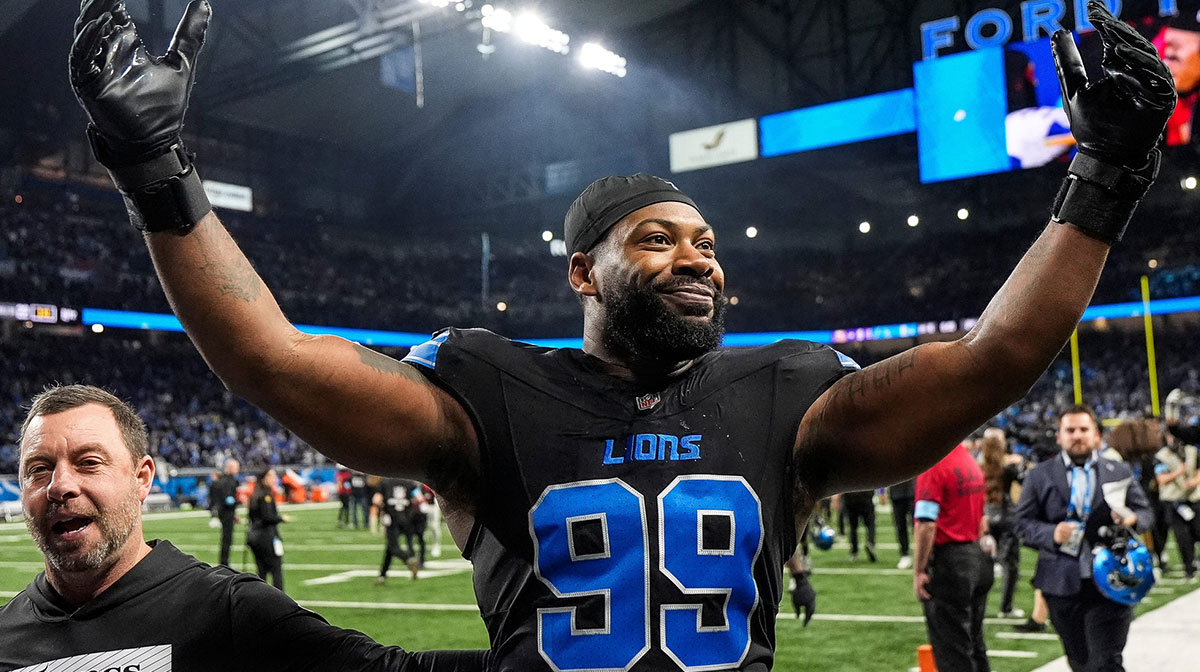 Detroit Lions defensive end Za'Darius Smith (99) celebrates 31-9 win over Minnesota Vikings as he exits the field at Ford Field in Detroit on Sunday, Jan. 5, 2025.