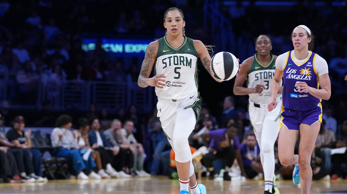 Seattle Storm forward Gabby Williams (5) dribbles the ball against LA Sparks forward Dearica Hamby (5) in the second half at Crypto.com Arena.