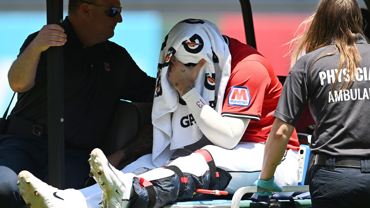 Cleveland Guardians shortstop Gabriel Arias (13) leaves the field after suffering an injury trying to field a ground ball hit by St. Louis Cardinals shortstop Masyn Winn.