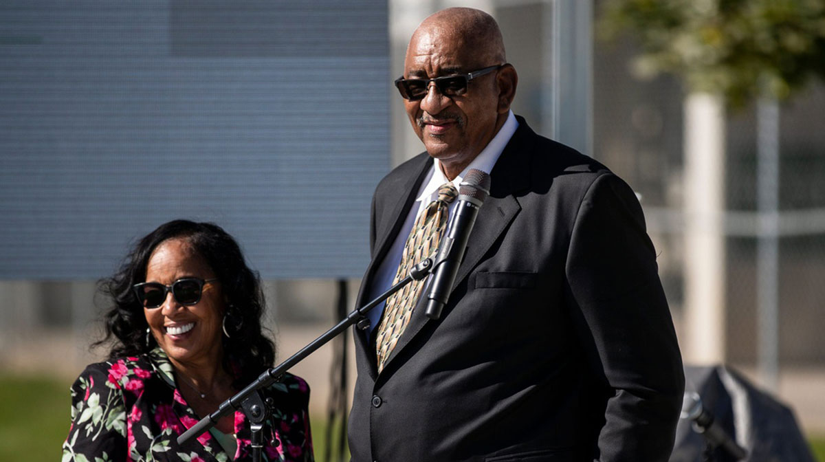 George Gervin speaks next to his wife Joyce King during the unveiling of George Gervin statue in front of EMU's George Gervin GameAbove Center in Ypsilanti on Thursday, August 31, 2023.