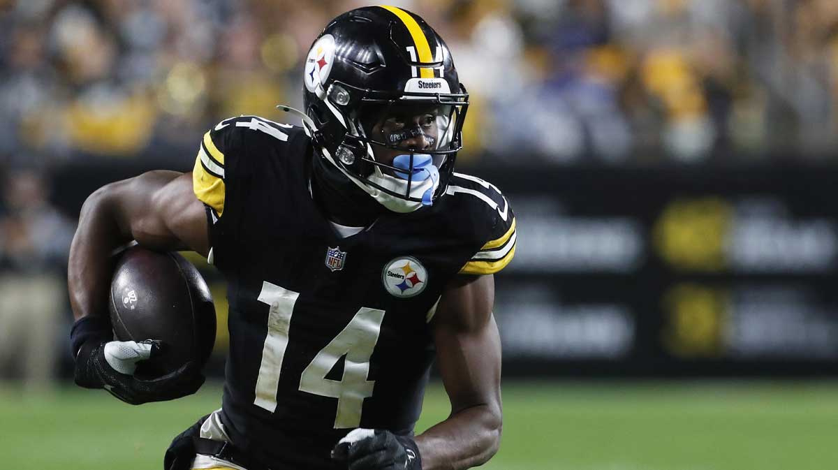 ; Pittsburgh Steelers wide receiver George Pickens (14) runs after a catch against the Dallas Cowboys during the fourth quarter at Acrisure Stadium.