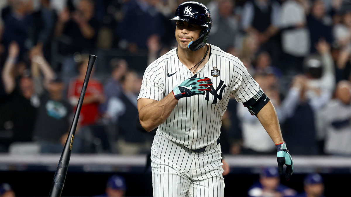 New York Yankees designated hitter Giancarlo Stanton (27) reacts after hitting a home run during the third inning against the Los Angeles Dodgers in game five of the 2024 MLB World Series at Yankee Stadium