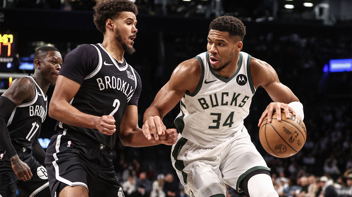 Milwaukee Bucks forward Giannis Antetokounmpo (34) looks to drive past Brooklyn Nets forward Cameron Johnson (2) in the first quarter at Barclays Center.