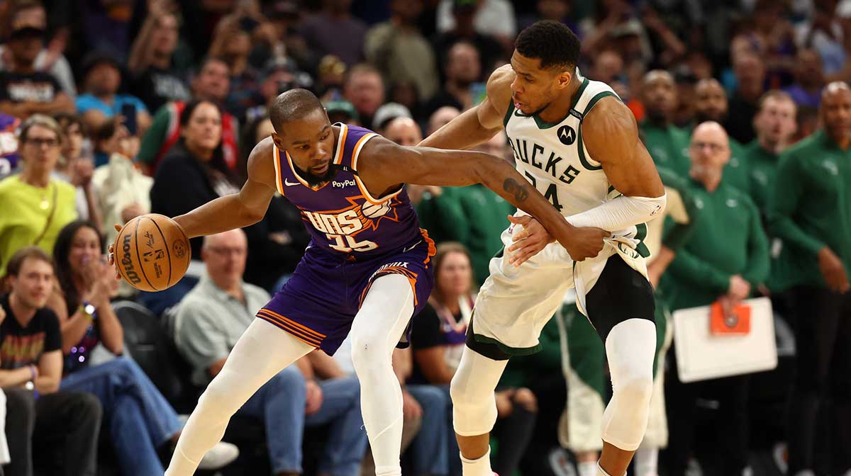 Milwaukee Bucks forward Giannis Antetokounmpo (34) defends against Phoenix Suns forward Kevin Durant (35) at Footprint Center.