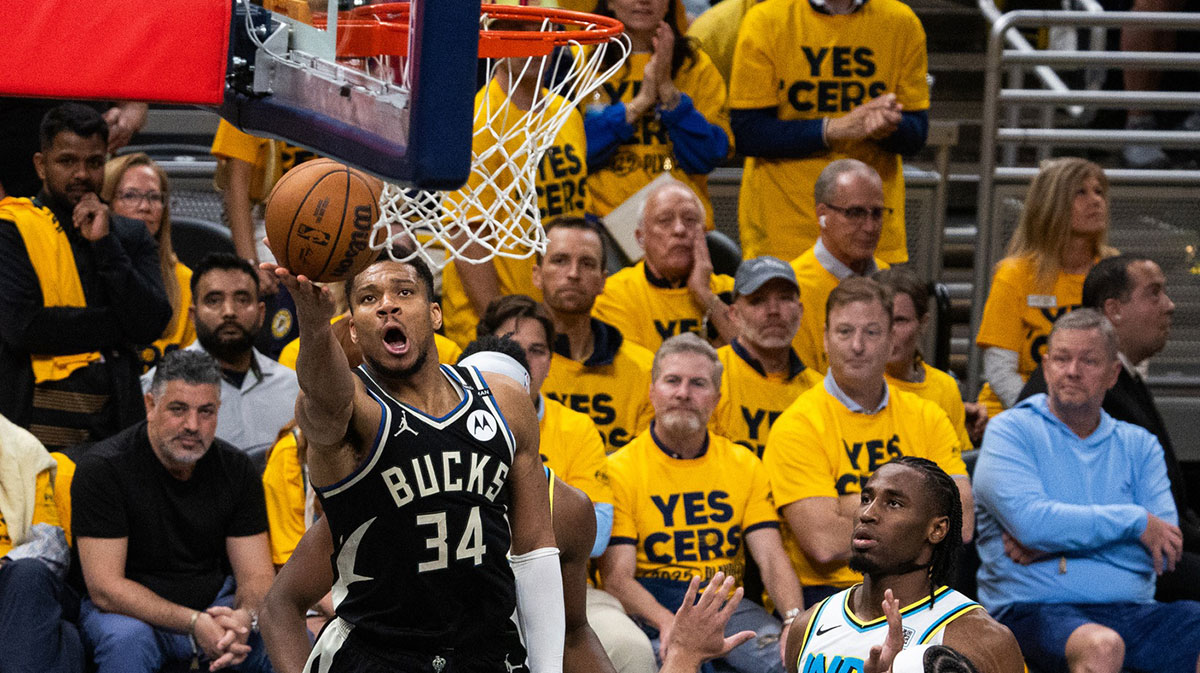 Milwaukee Bucks forward Giannis Antetokounmpo (34) shoots the ball while Indiana Pacers guard Andrew Nembhard (2) defends during game five of the first round for the 2024 NBA Playoffs at Gainbridge Fieldhouse.