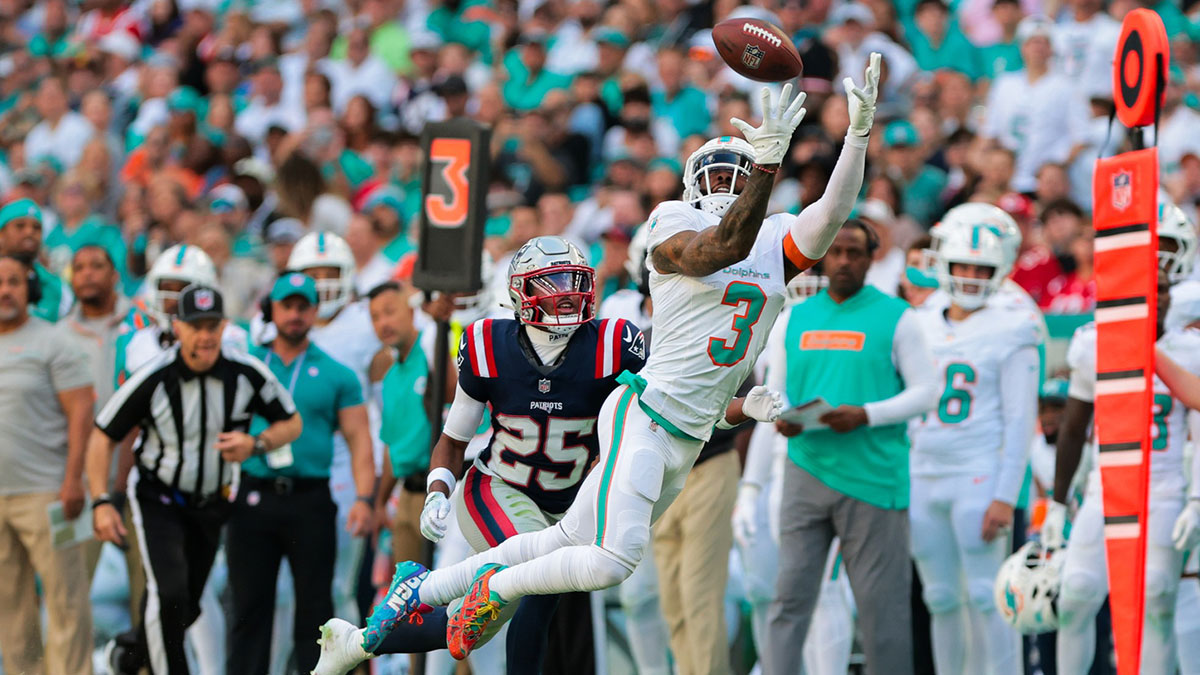 Miami Dolphins wide receiver Odell Beckham Jr. (3) dives but cannot make a catch against New England Patriots cornerback Marcus Jones (25) during the third quarter at Hard Rock Stadium.