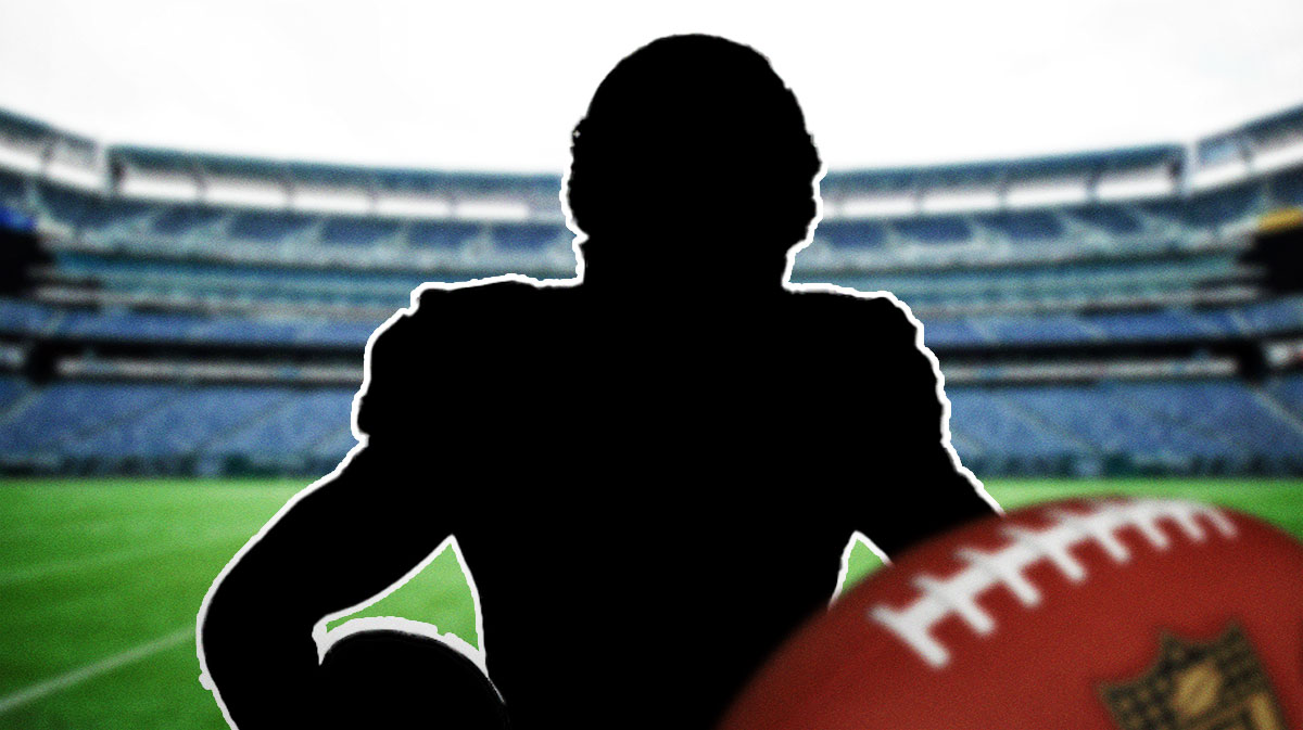 Silhouette of former New York Giants receiver Hakeem Nicks with MetLife Stadium background.