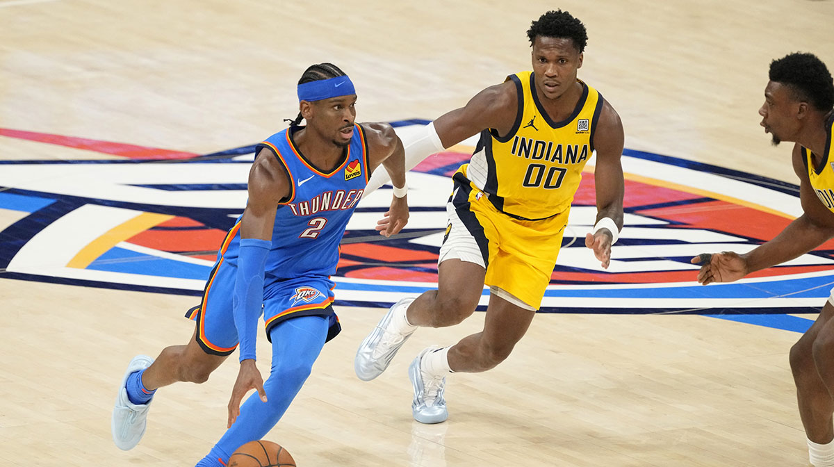 Oklahoma City Thunder guard Shai Gilgeous-Alexander (2) dribbles the ball against the Indiana Pacers during the second half during game two of the 2025 NBA Finals at Paycom Center.