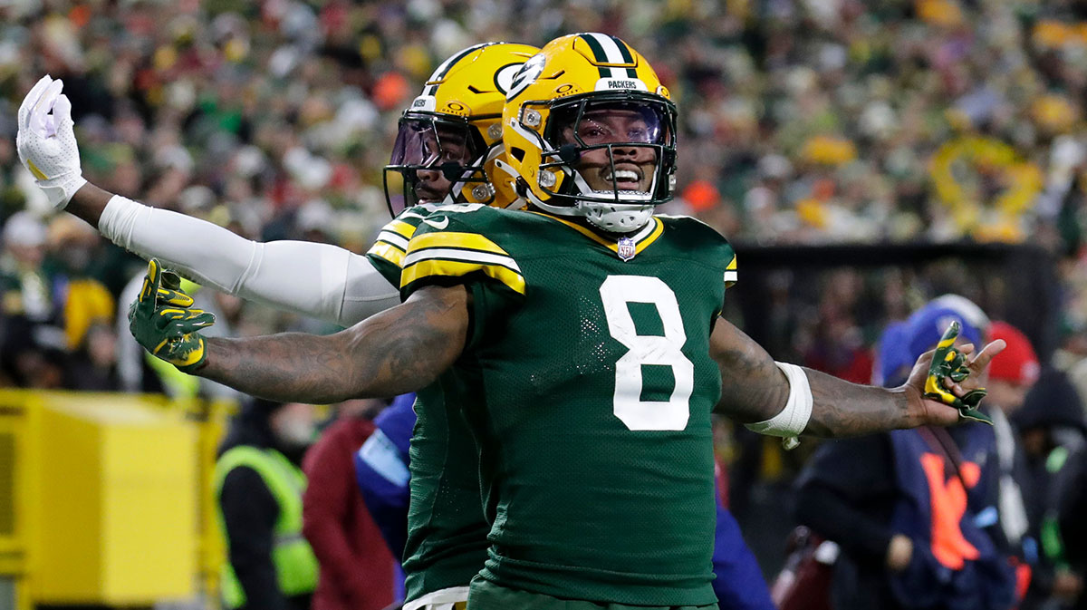 Green Bay Packers running back Josh Jacobs (8) celebrates scoring a touchdown with wide receiver Bo Melton (80) against the San Francisco 49ers during their football game Sunday, November 24, 2024, at Lambeau Field in Green Bay, Wisconsin.