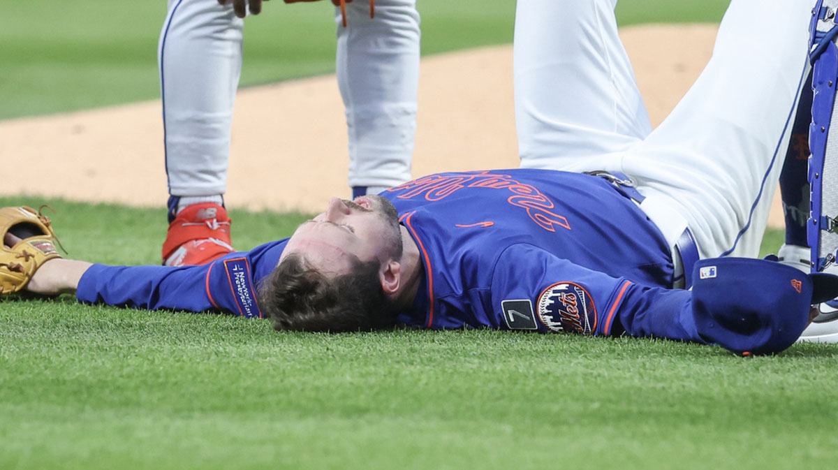 New York Mets starting pitcher Griffin Canning (46) lays on the ground after getting injured in the third inning against the Atlanta Braves at Citi Field.
