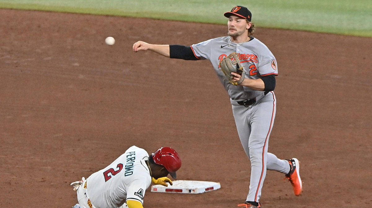 Baltimore Orioles shortstop Gunnar Henderson (2) turns a double play on Arizona Diamondbacks shortstop Geraldo Perdomo (2) in the sixth inning at Chase Field.