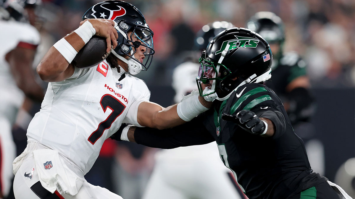 Houston Texans quarterback C.J. Stroud (7) is pressured by New York Jets defensive end Haason Reddick (7) during the first quarter at MetLife Stadium.