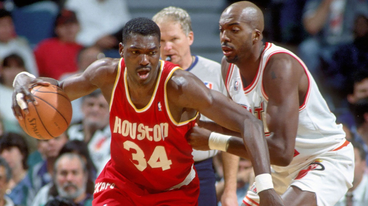Houston Rockets center #34 HAKEEM OLAJUWON in action against JOHN SALLEY of the Miami Heat at the Miami Arena during the 1994-95 season.