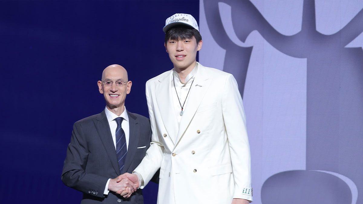 Yang Hansen stands with NBA commissioner Adam Silver after being selected as the 16th pick by the Memphis Grizzlies in the first round of the 2025 NBA Draft at Barclays Center.