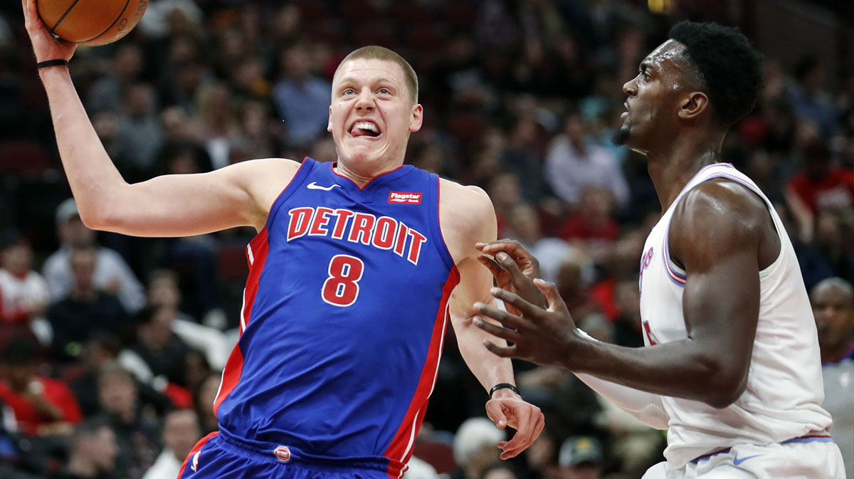 Detroit Pistons forward Henry Ellenson (8) drives to the basket against Chicago Bulls forward Bobby Portis (5) during the second half at United Center.