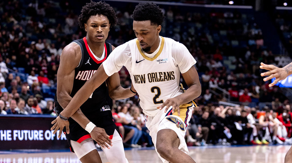 New Orleans Pelicans forward Herb Jones (2) dribbles against Houston Rockets forward Amen Thompson (1) during the second half at Smoothie King Center.