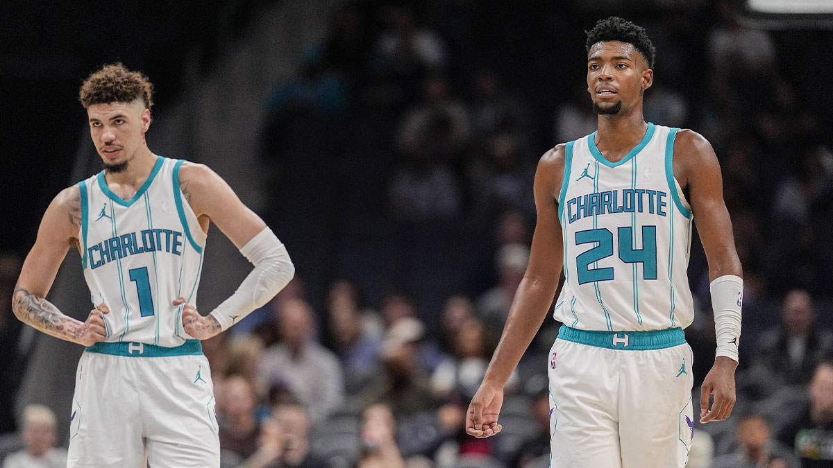 Charlotte Hornets guard LaMelo Ball (1) and forward Brandon Miller (24) at mid court against the Miami Heat during the second half at Spectrum Center.