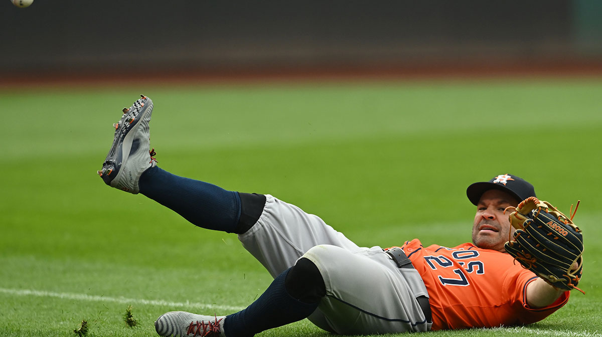 Houston Astros left fielder Jose Altuve (27) fails to catch a ball hit by Cleveland Guardians left fielder Steven Kwan (not pictured) during the ninth inning at Progressive Field.