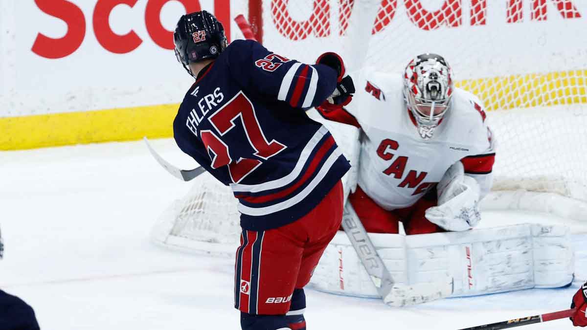 Carolina Hurricanes goalie Pyotr Kocketkov (52) makes a save on a shot by Winnipeg Jets forward Nikolaj Ehlers (27) during the third period at Canada Life Centre