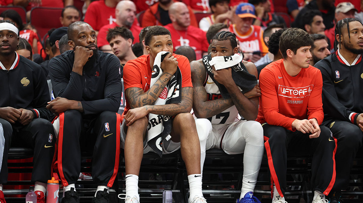 Houston Rockets forward Jabari Smith Jr. (middle left) and forward Tari Eason (middle right) hold towels on their faces during game seven of the first round for the 2025 NBA Playoffs against the Golden State Warriors at Toyota Center.