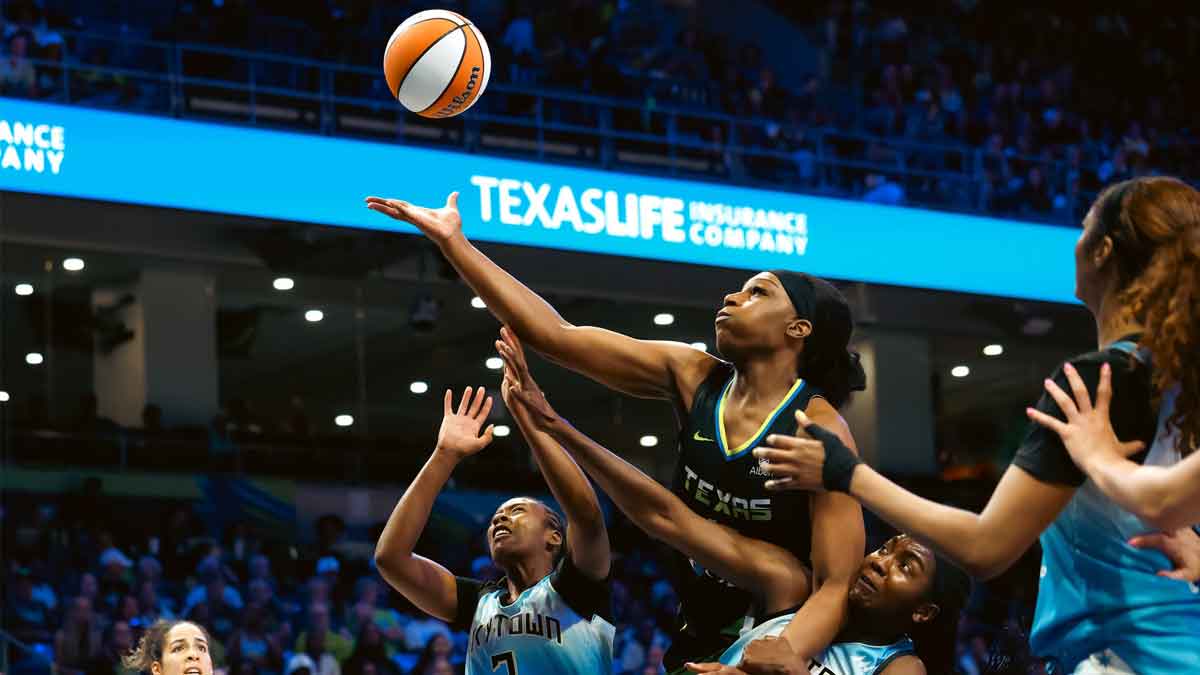 Dallas Wings center Teaira McCowan (15) battles for a rebound over Chicago Sky guard Ariel Atkins (7) and center Elizabeth Williams (1) during the second half at College Park Center.