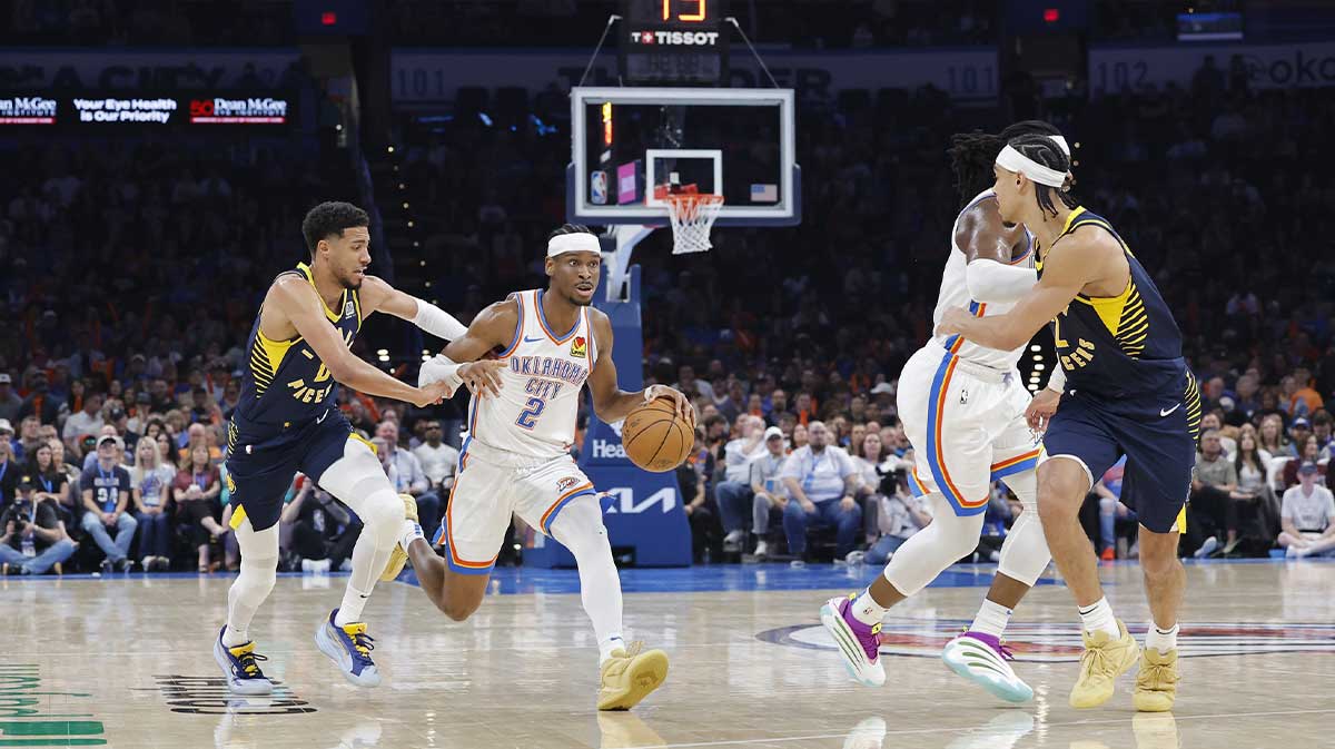 Oklahoma City Thunder guard Shai Gilgeous-Alexander (2) drives to the basket beside Indiana Pacers guard Tyrese Haliburton (0) during the second quarter at Paycom Center.