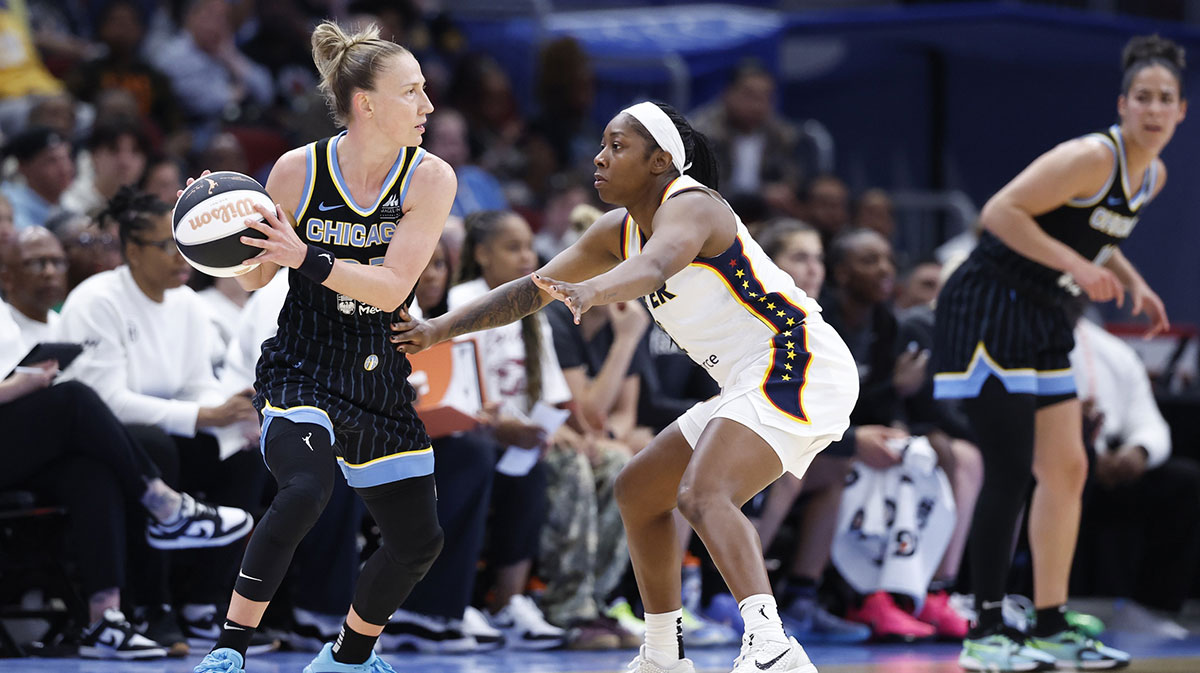 Chicago Sky guard Courtney Vandersloot (22) looks to pass the ball against Indiana Fever guard AariMcDonald (2) during the first half of a WNBA game at United Center.