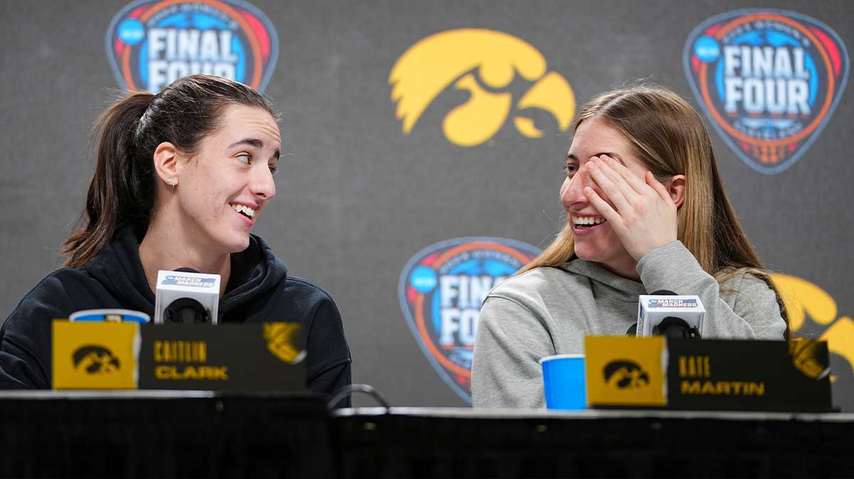 Iowa Hawkeyes guard Caitlin Clark (22) and Iowa Hawkeyes guard Kate Martin (20) take questions at Rocket Mortgage Arena, Thursday, April 4, 2024 in Cleveland.