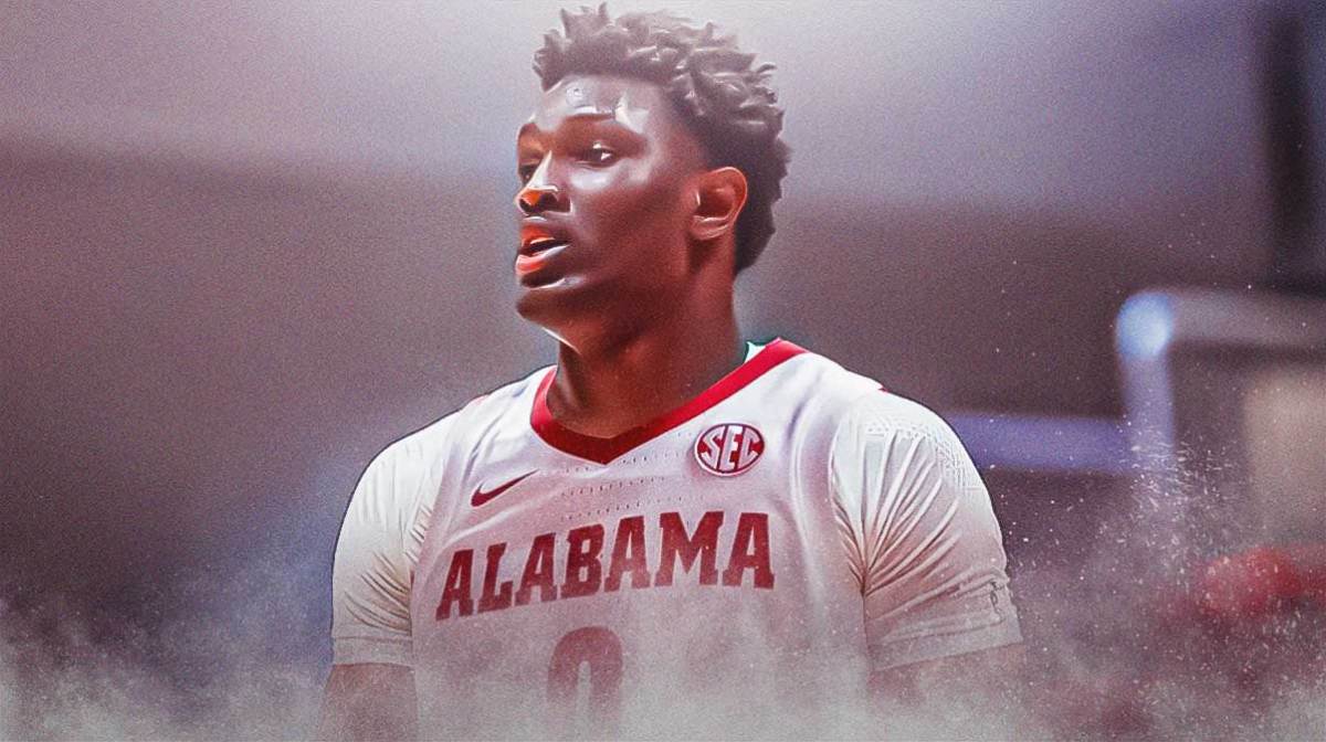 High school basketball player Collins Onyejiaka in an Alabama Crimson Tide basketball jersey, recruit reclassify