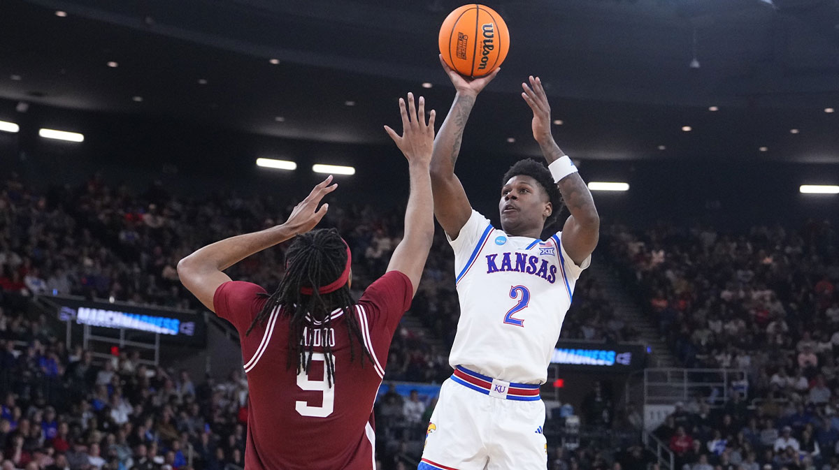 Kansas Jayhawks guard AJ Storr (2) shoots the ball against Arkansas Razorbacks forward Jonas Aidoo (9) during the second half at Amica Mutual Pavilion.