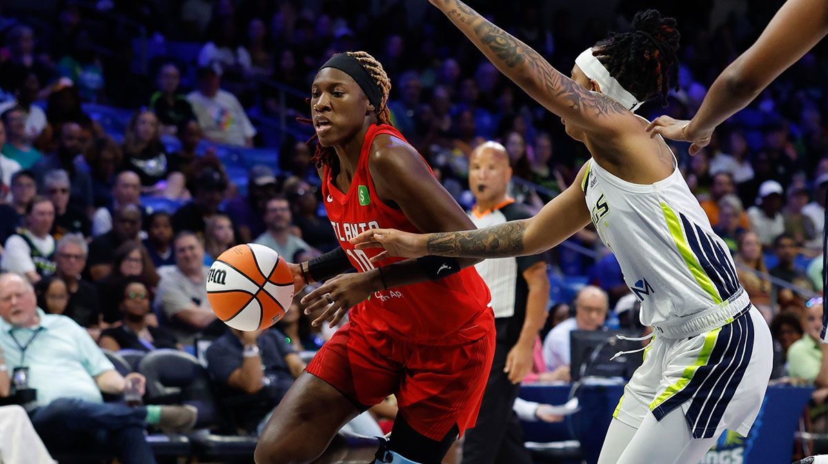 Atlanta Dream guard Rhyne Howard (10) drives to the basket against Dallas Wings guard Aziaha James (10) during the first half at College Park Center.