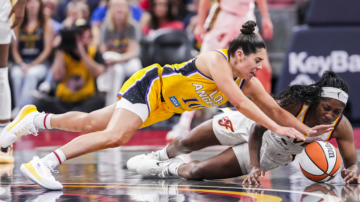 Los Angeles Sparks guard Kelsey Plum (10) and Indiana Fever guard Aari McDonald (2) go for a loose ball Thursday, June 26, 2025, during a game between the Indiana Fever and the Los Angeles Sparks at Gainbridge Fieldhouse in Indianapolis. The Los Angeles Sparks defeated the Indiana Fever, 85-75.
