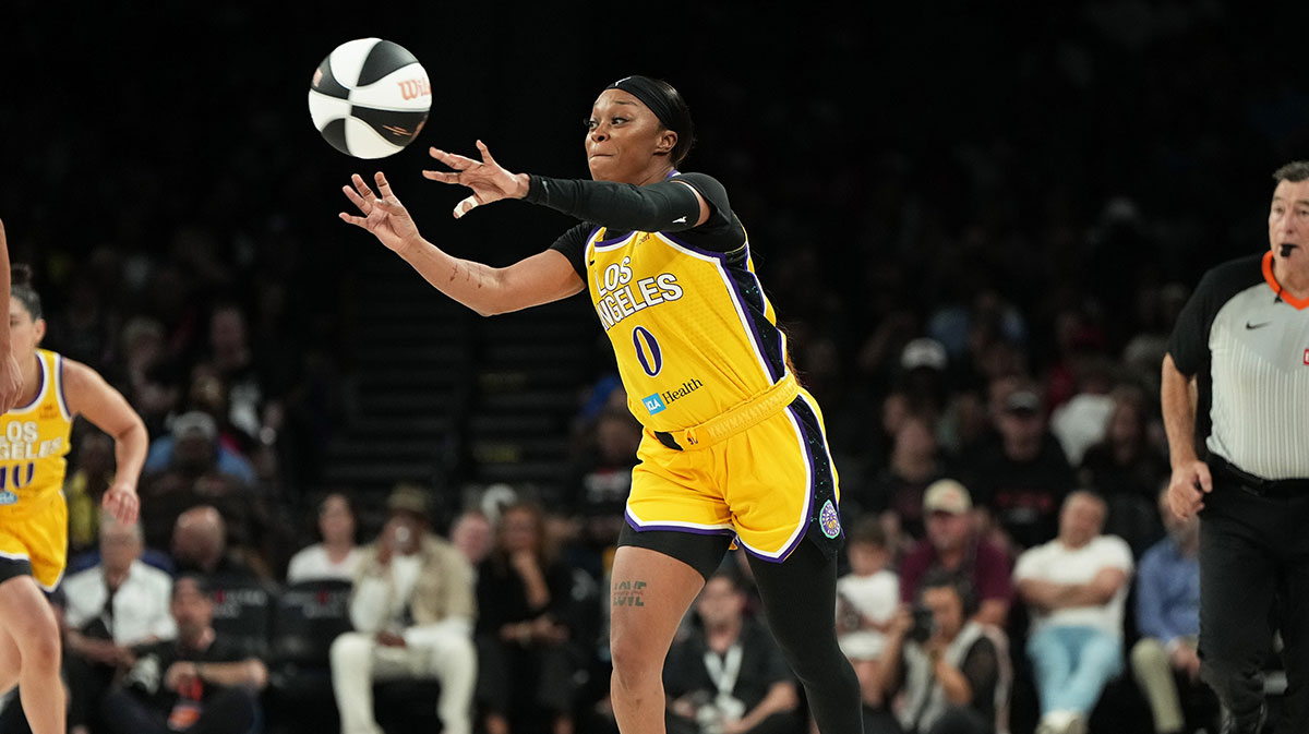 Los Angeles Sparks guard Odyssey Sims (0) passes the ball across the court during the second half of a WNBA basketball game against the Las Vegas Aces at Michelob Ultra Arena.