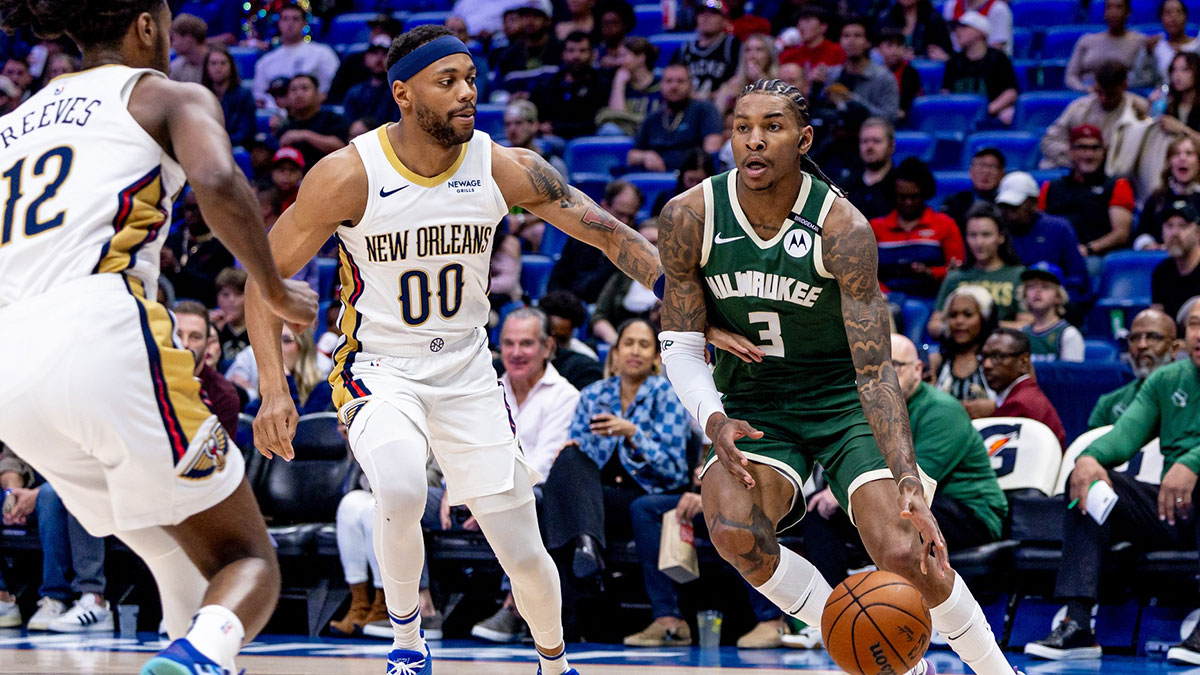 Milwaukee Bucks guard Kevin Porter Jr. (3) dribbles against New Orleans Pelicans forward Bruce Brown (00) during the first half at Smoothie King Center.