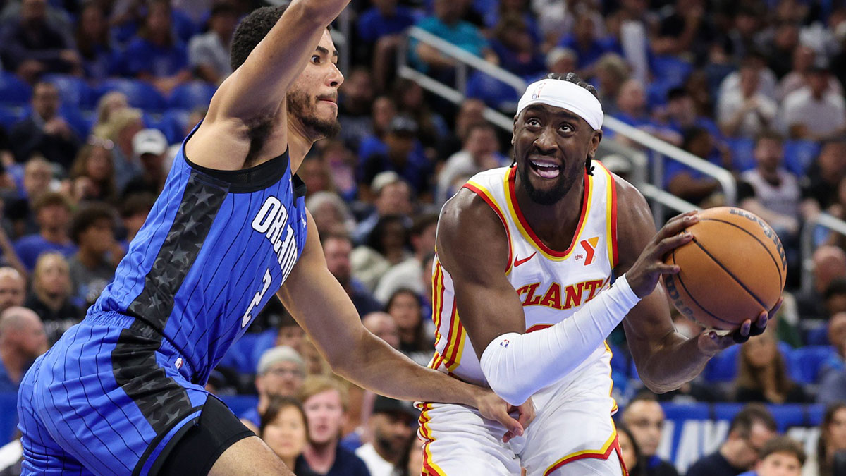 Orlando Magic guard Caleb Houstan (2) guards Atlanta Hawks guard Caris LeVert (3) in the first quarter at Kia Center.