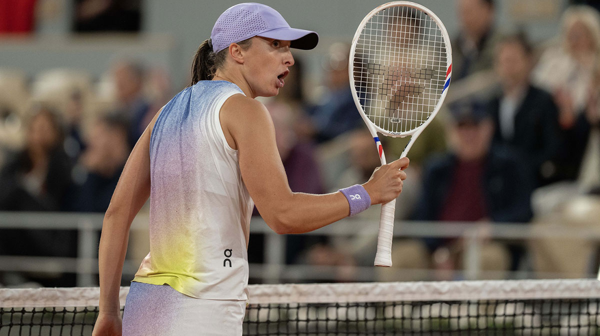Iga Swiatek of Poland reacts to a point during her match against Aryna Sabalenka on day 12 at Roland Garros Stadium.
