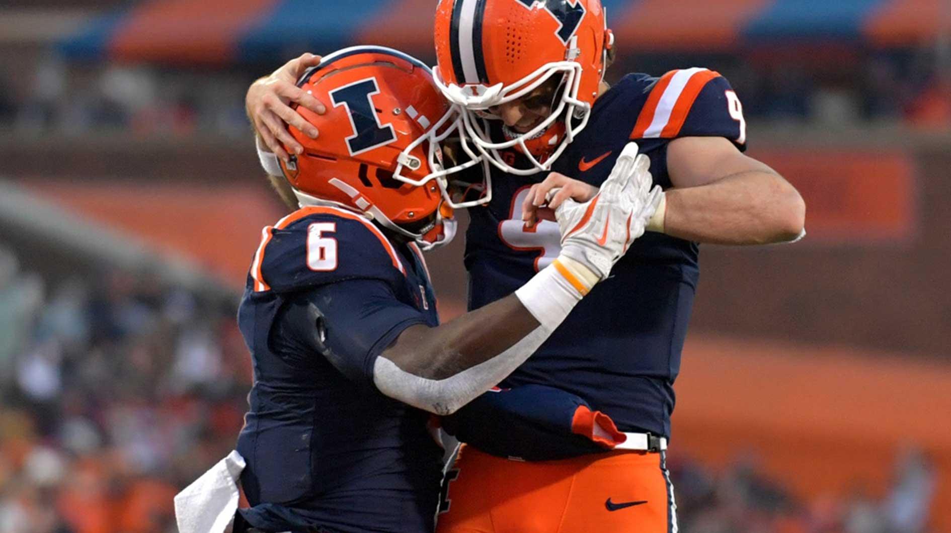 Illinois Fighting Illini quarterback Luke Altmyer (9) and running back Josh McCray (6) celebrate McCray’s touchdown during the second half at Memorial Stadium.