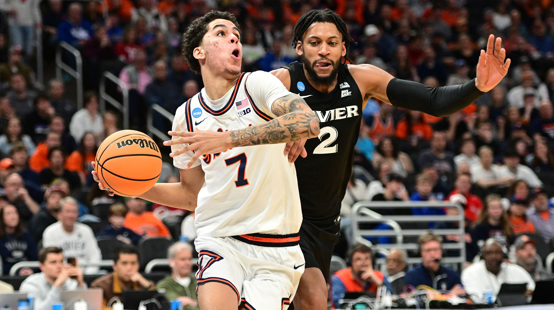 Illinois Fighting Illini forward Will Riley (7) drives to the hoop past Xavier Musketeers forward Jerome Hunter (2) during the second half at Fiserv Forum.