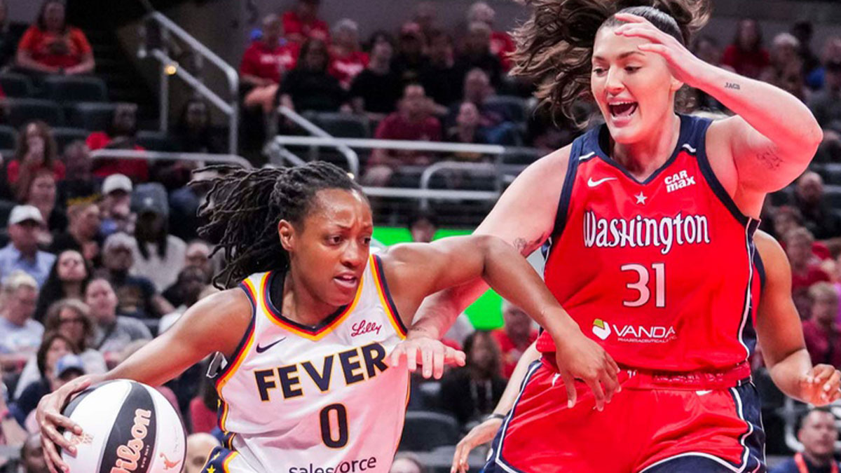 ashington Mystics center Stefanie Dolson (31) guards Indiana Fever guard Kelsey Mitchell (0) during a game between the Indiana Fever and the Washington Mystics at Gainbridge Fieldhouse in Indianapolis.