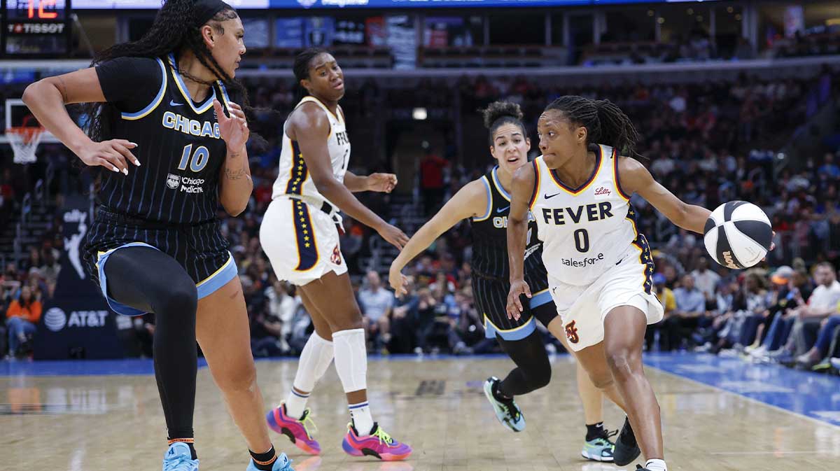 Indiana Fever guard Kelsey Mitchell (0) drives to the basket against the Chicago Sky during the first half of a WNBA game at United Center.