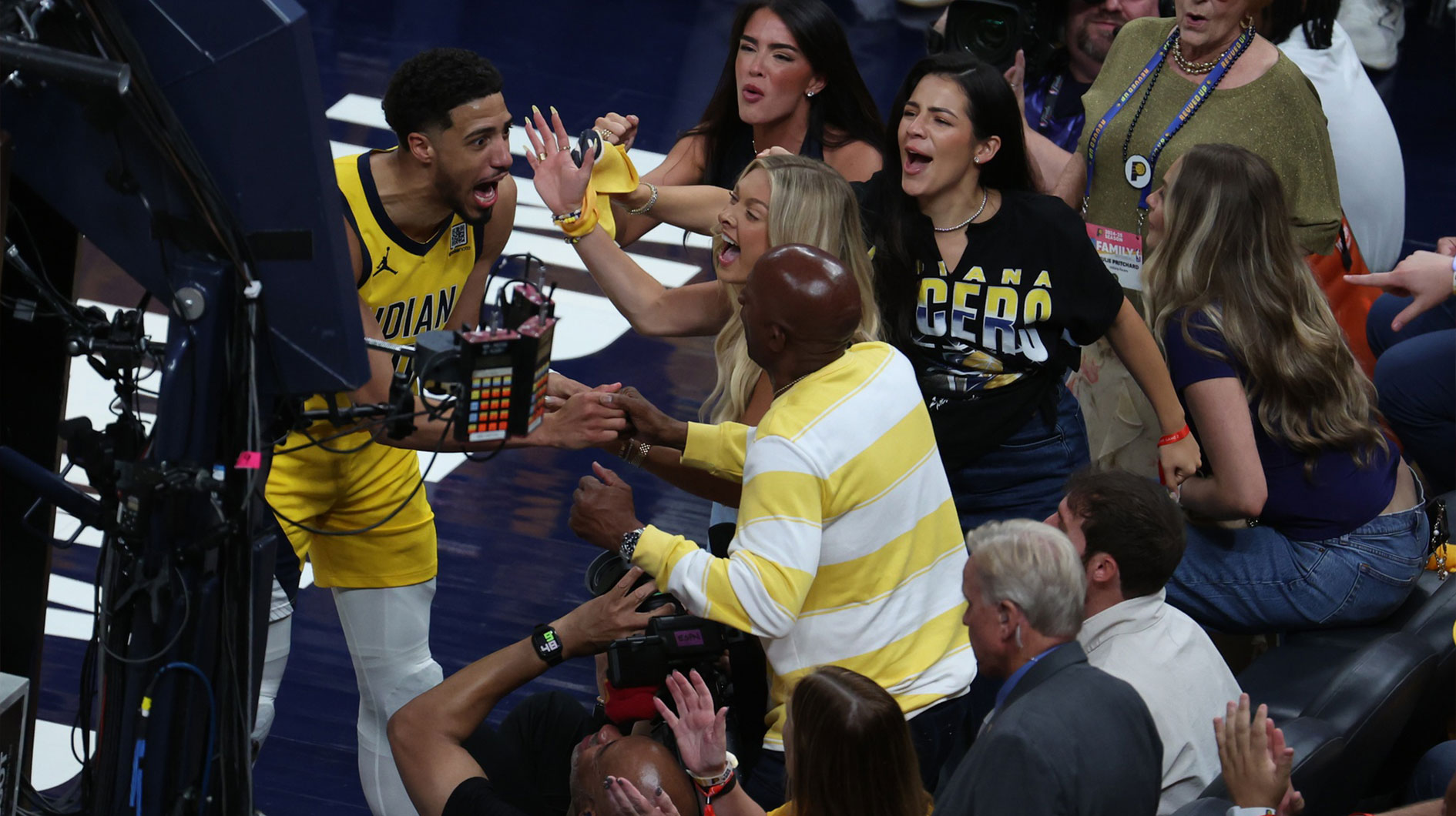 Indiana Pacers guard Tyrese Haliburton (0) reacts with his girlfriend Jade Jones and father John Haliburton following the second quarter against the Oklahoma City Thunder in game four of the 2025 NBA Finals at Gainbridge Fieldhouse.