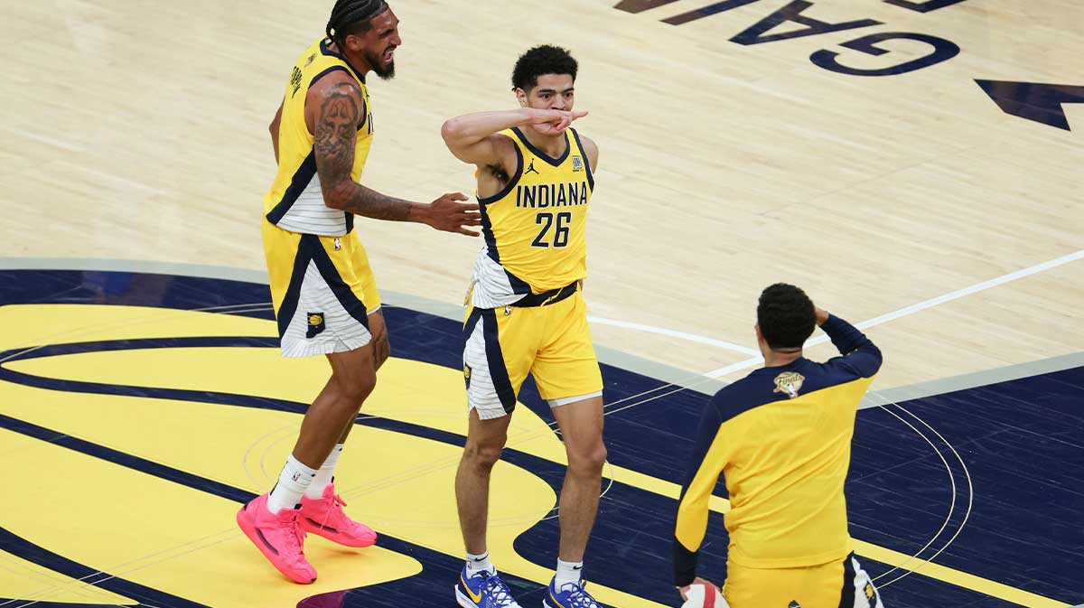 Indiana Pacers guard Ben Sheppard (26) celebrates with teammates after hitting a shot against the Oklahoma City Thunder as time expires in the third quarter during game six of the 2025 NBA Finals at Gainbridge Fieldhouse.