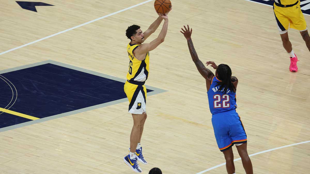 Indiana Pacers guard Ben Sheppard (26) shoots a three point basket over Oklahoma City Thunder guard Cason Wallace (22) during the second quarter of game four of the 2025 NBA Finals at Gainbridge Fieldhouse.