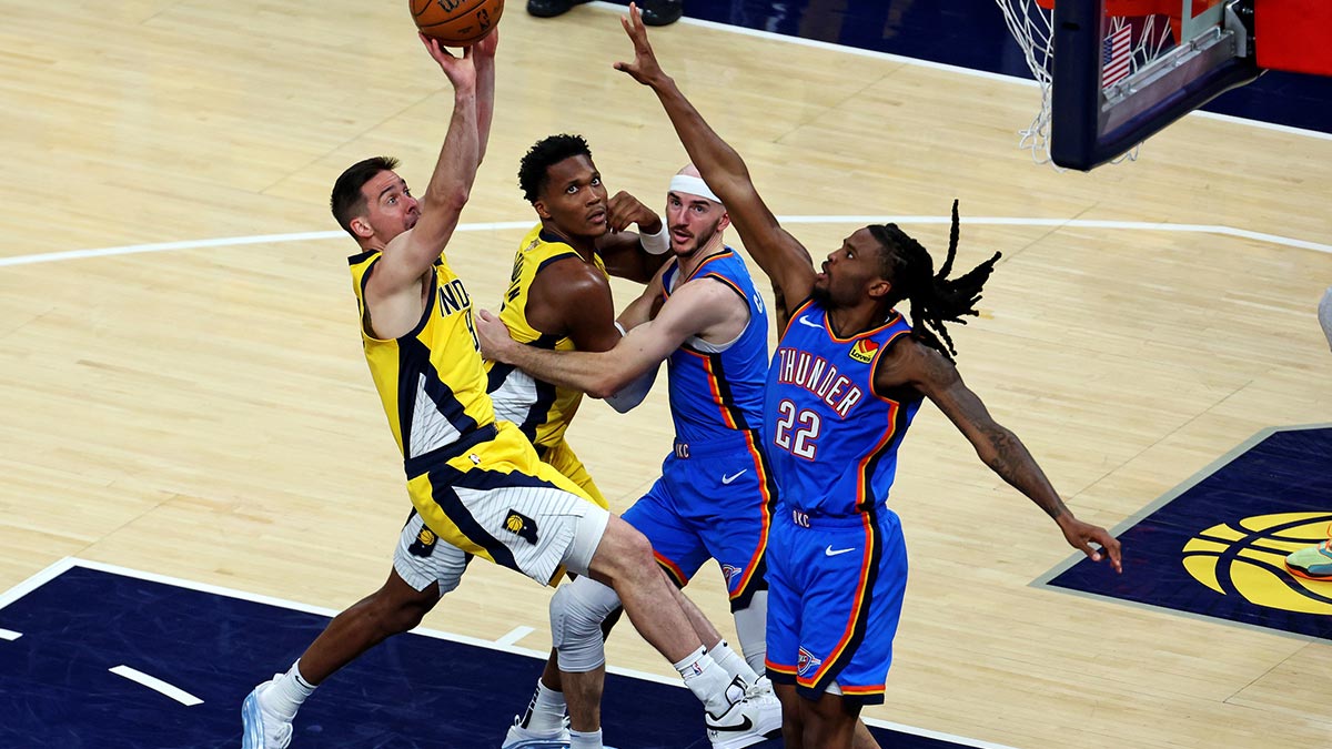 Indiana Pacers guard T.J. McConnell (9) shoots the ball against Oklahoma City Thunder guard Cason Wallace (22) during the second quarter in game three of the 2025 NBA Finals at Gainbridge Fieldhouse.