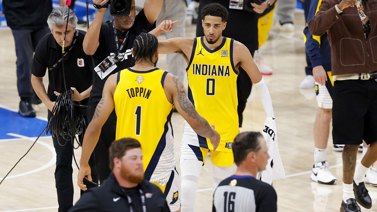 Indiana Pacers guard Tyrese Haliburton (0) and forward Obi Toppin (1) celebrate after the Pacers defeat the Oklahoma City Thunder during game one of the 2025 NBA Finals at Paycom Center.