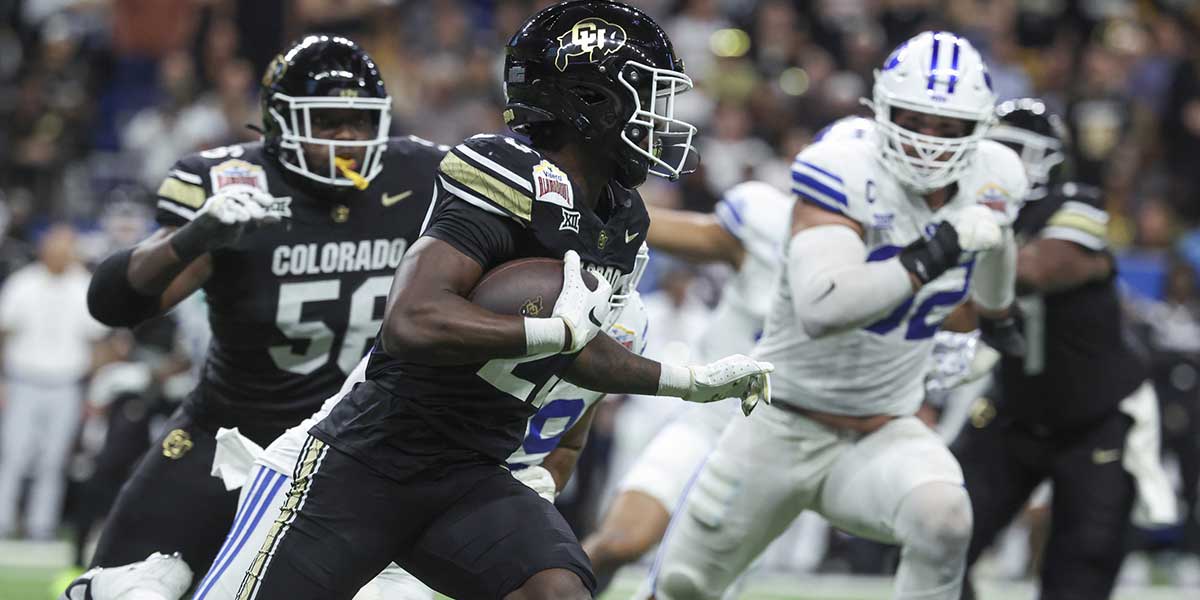 Colorado Buffaloes running back Isaiah Augustave (23) runs with the ball during the second quarter against the Brigham Young Cougars at Alamodome.