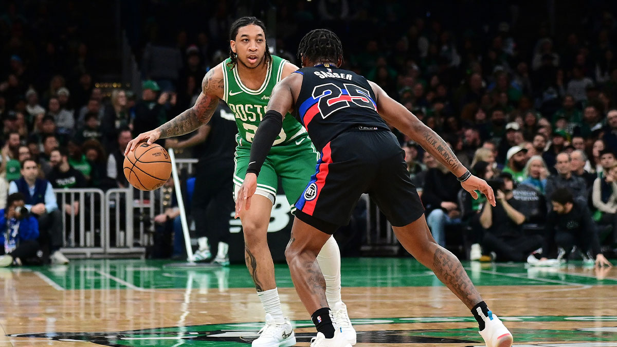 Boston Celtics guard JD Davison (20) dribbles against Detroit Pistons guard Marcus Sasser (25) during the second half at TD Garden.