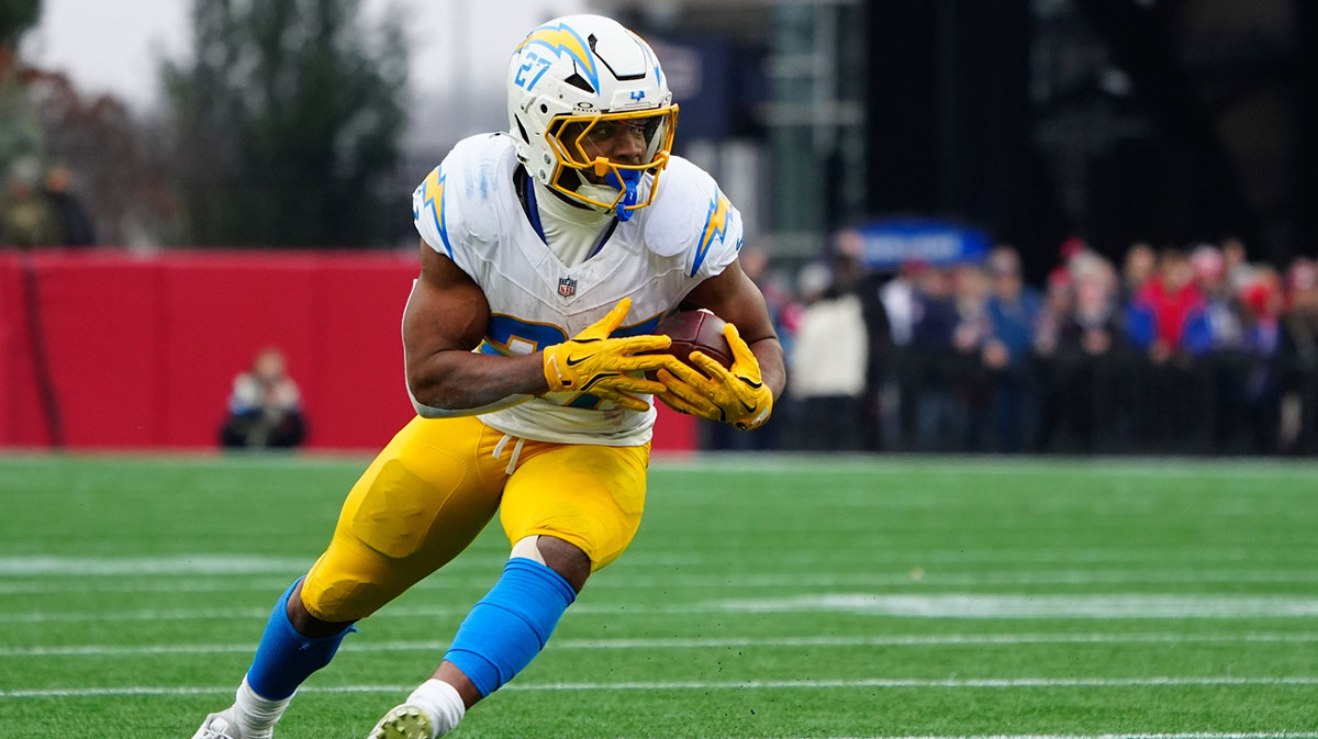Dec 28, 2024; Foxborough, Massachusetts, USA; Los Angeles Chargers running back J.K. Dobbins (27) runs with the ball after making a catch against the New England Patriots during the first half at Gillette Stadium. Mandatory Credit: Gregory Fisher-Imagn Images