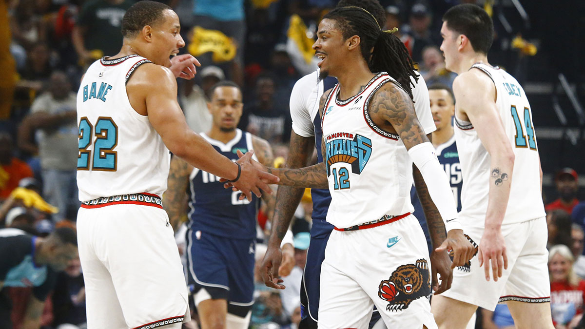 Memphis Grizzlies guard Ja Morant (12) reacts with guard Desmond Bane (22) during the first quarter against the Dallas Mavericks at FedExForum.