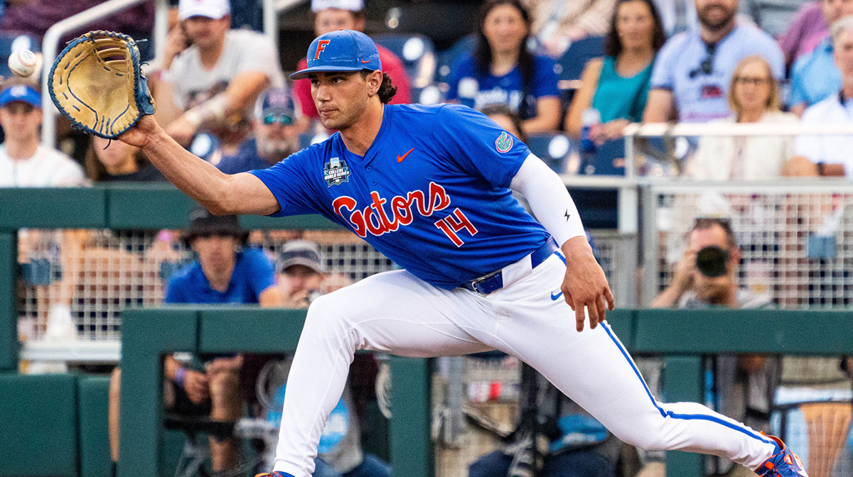 Florida Gators first baseman Jac Caglianone (14) gets an out against the Texas A&M Aggies during the fourth inning at Charles Schwab Field Omaha.